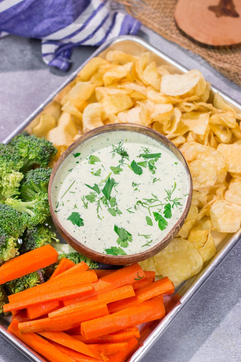 This Goat Cheese Ranch Dip is an easy and delicious party appetizer recipe! It can also be turned into a salad dressing. It's packed with flavor no matter how you serve it!