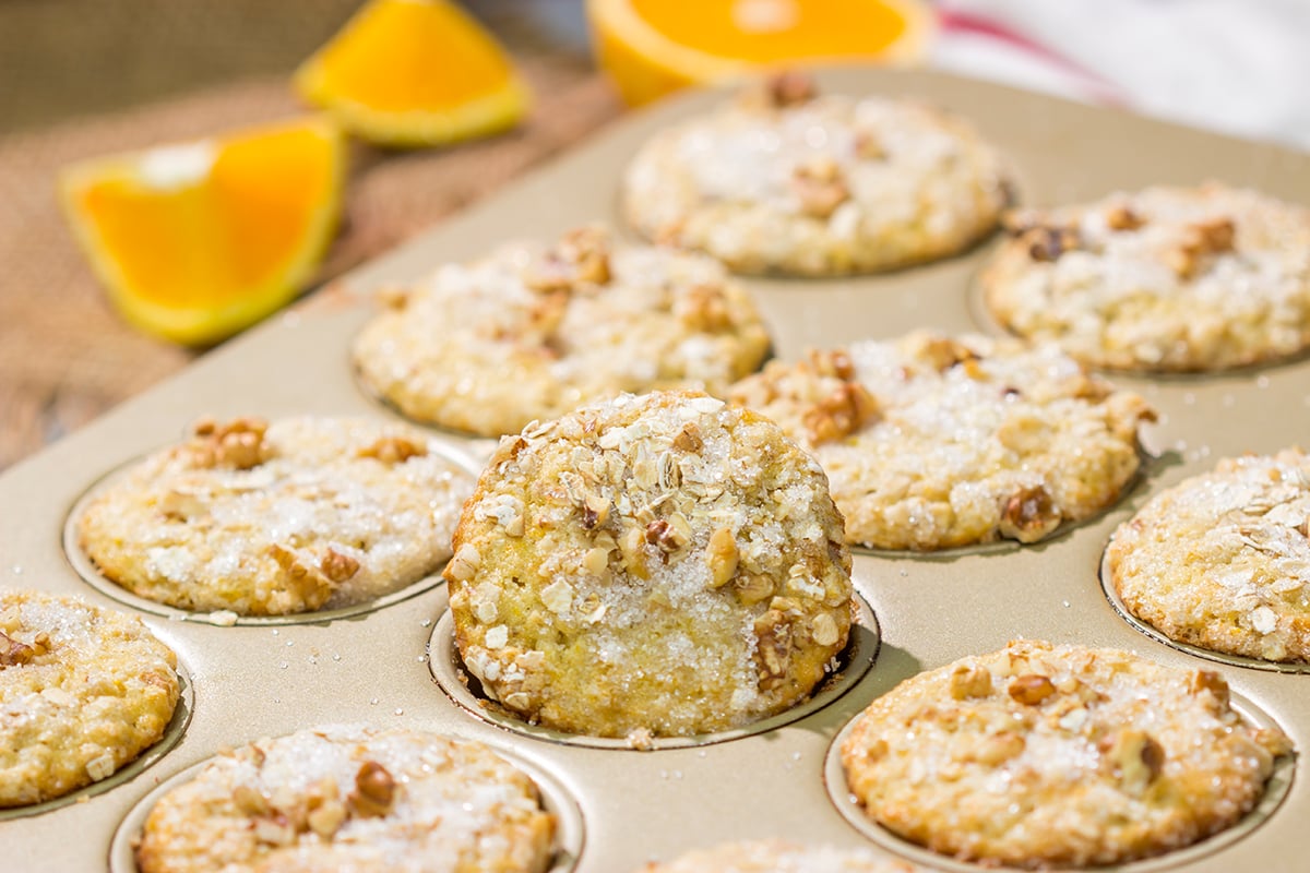 These Orange Walnut Muffins are bursting with citrus flavor. Add in the nutty walnuts, and you've got a fantastic treat for breakfast or brunch!