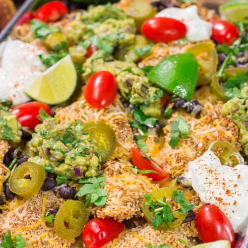 Skip the chips! These Toasted Ravioli Nachos feature all of your favorite nacho toppings on top of toasted ravioli. Go ahead and make an extra batch...you'll need it!