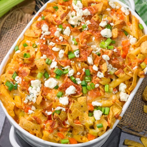 This Buffalo Chicken Casserole features the spicy flavor of buffalo wings combined with the cozy comfort of a pasta bake. This hearty meal is perfect for gamedays or dinners at home!