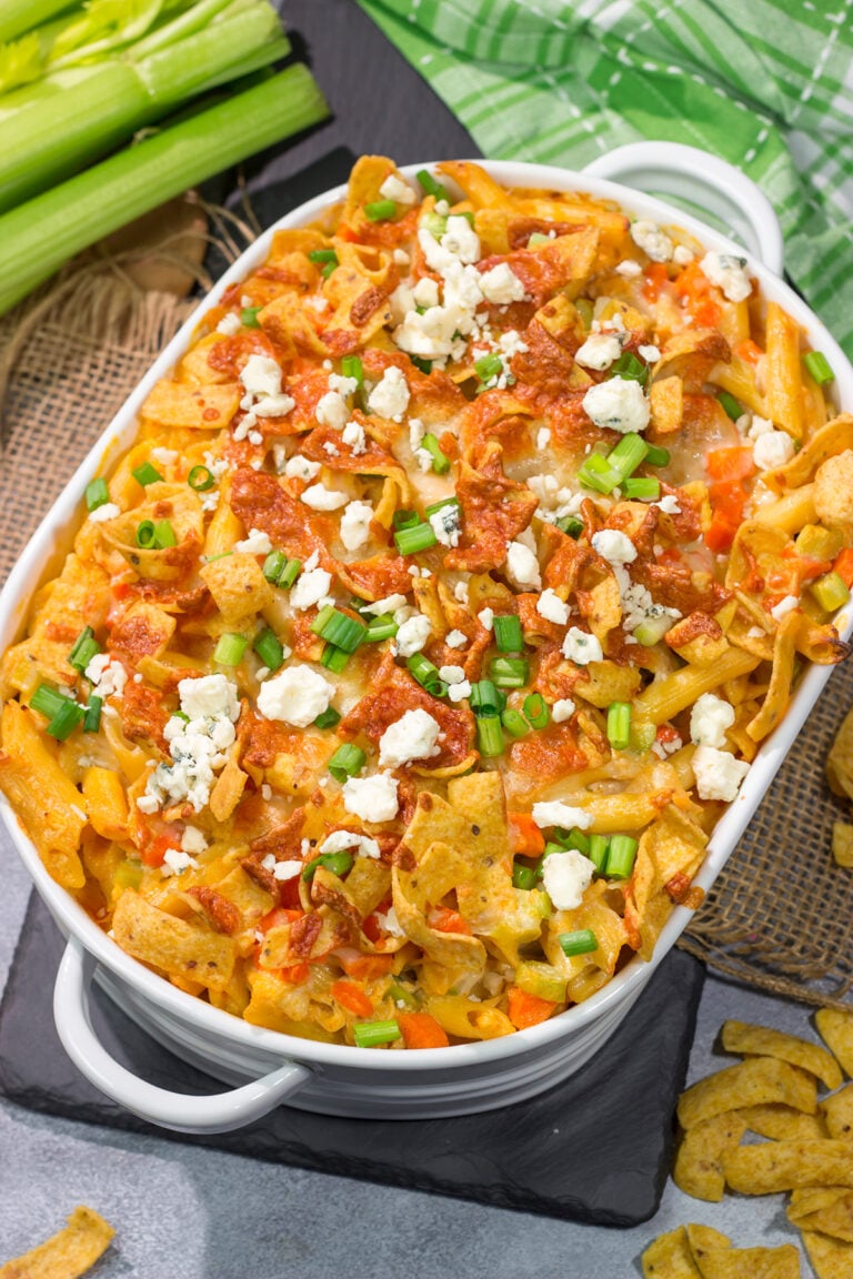 This Buffalo Chicken Casserole features the spicy flavor of buffalo wings combined with the cozy comfort of a pasta bake. This hearty meal is perfect for gamedays or dinners at home!