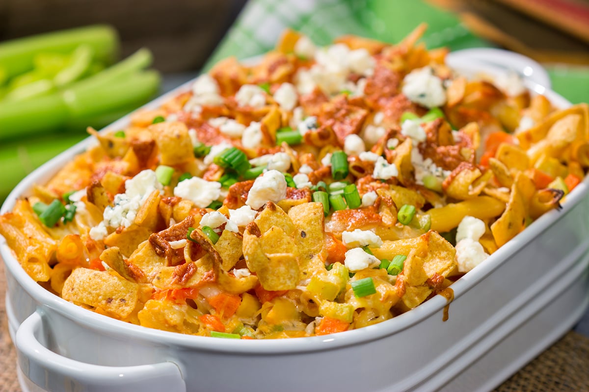 This Buffalo Chicken Casserole features the spicy flavor of buffalo wings combined with the cozy comfort of a pasta bake. This hearty meal is perfect for gamedays or dinners at home!