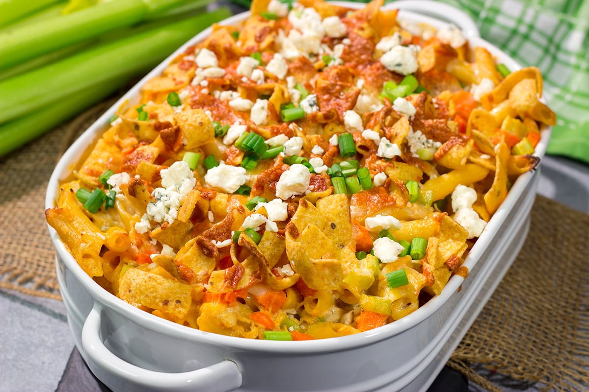 This Buffalo Chicken Casserole features the spicy flavor of buffalo wings combined with the cozy comfort of a pasta bake. This hearty meal is perfect for gamedays or dinners at home!