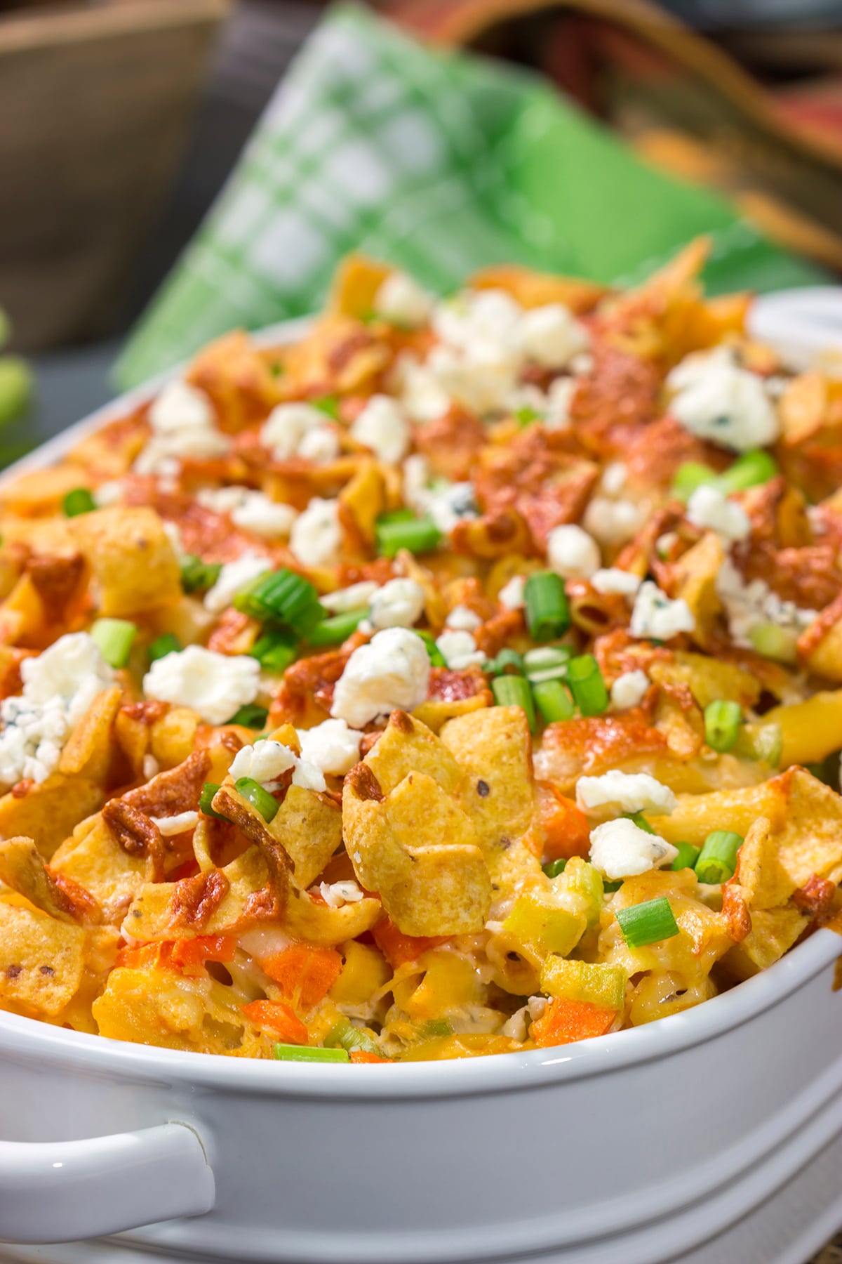 This Buffalo Chicken Casserole features the spicy flavor of buffalo wings combined with the cozy comfort of a pasta bake. This hearty meal is perfect for gamedays or dinners at home!