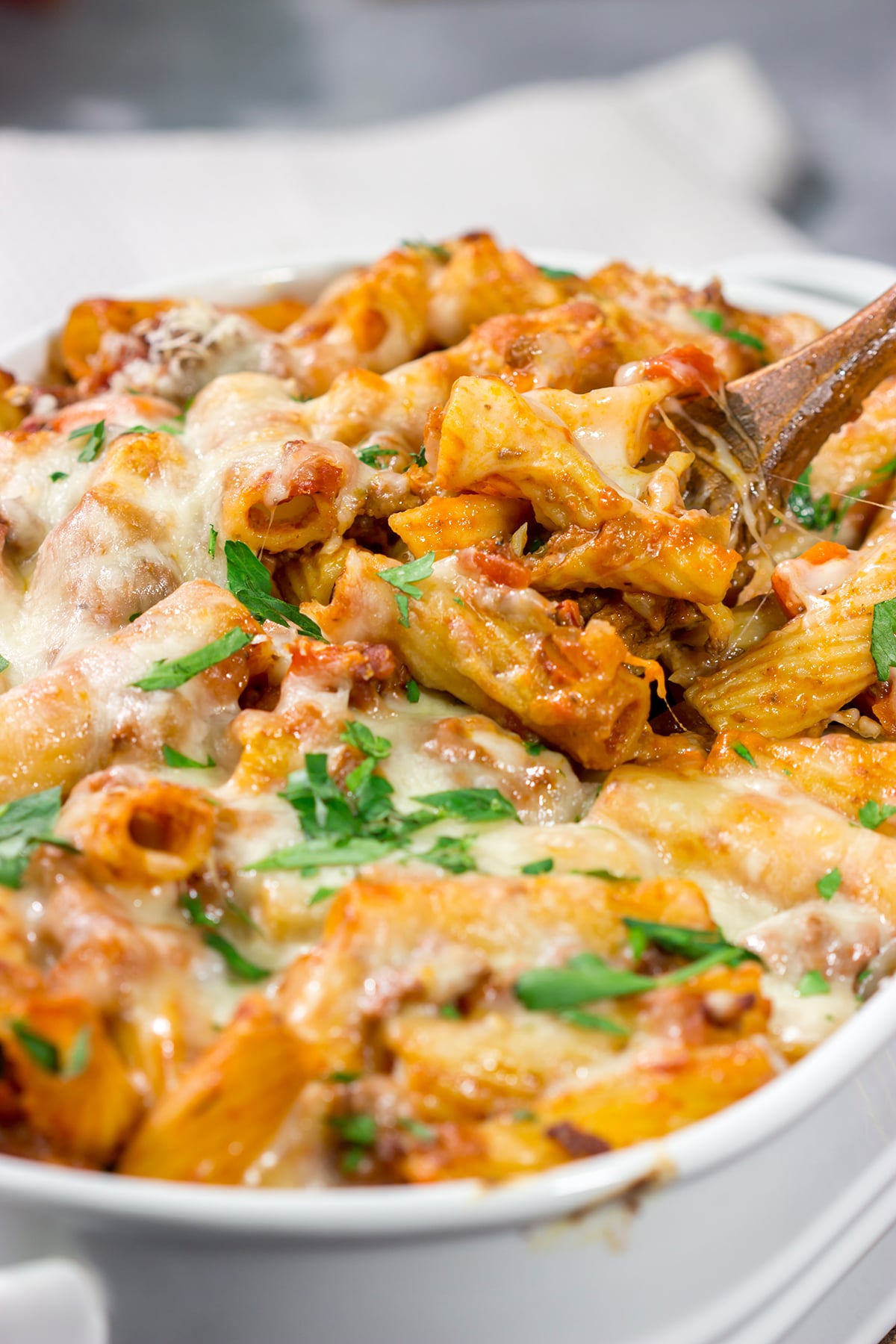 This Baked Pasta Bolognese is the ultimate comfort food! The homemade Bolognese sauce is layered with pasta and cheese to create a delicious recipe that's sure to become a family favorite!