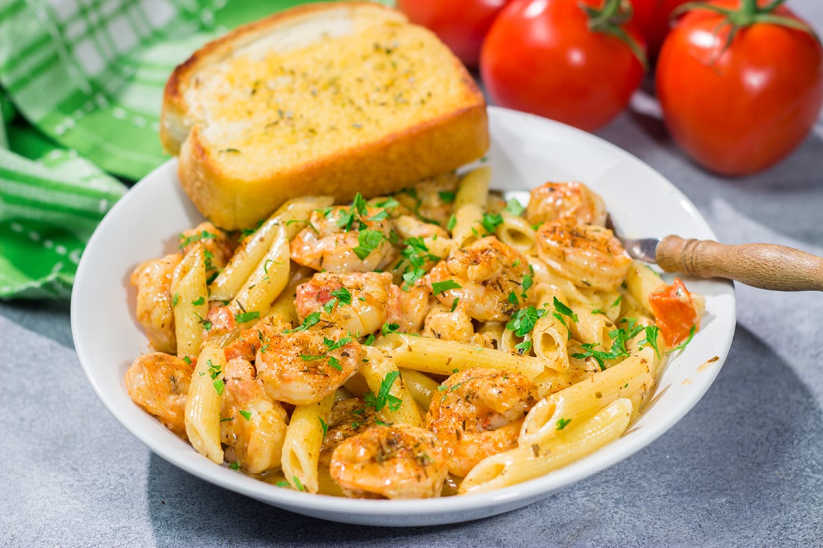 This Copycat Chili's Cajun Shrimp Pasta features creamy alfredo sauce tossed with succulent Cajun shrimp. It's delicious - and easy enough for a weeknight meal!