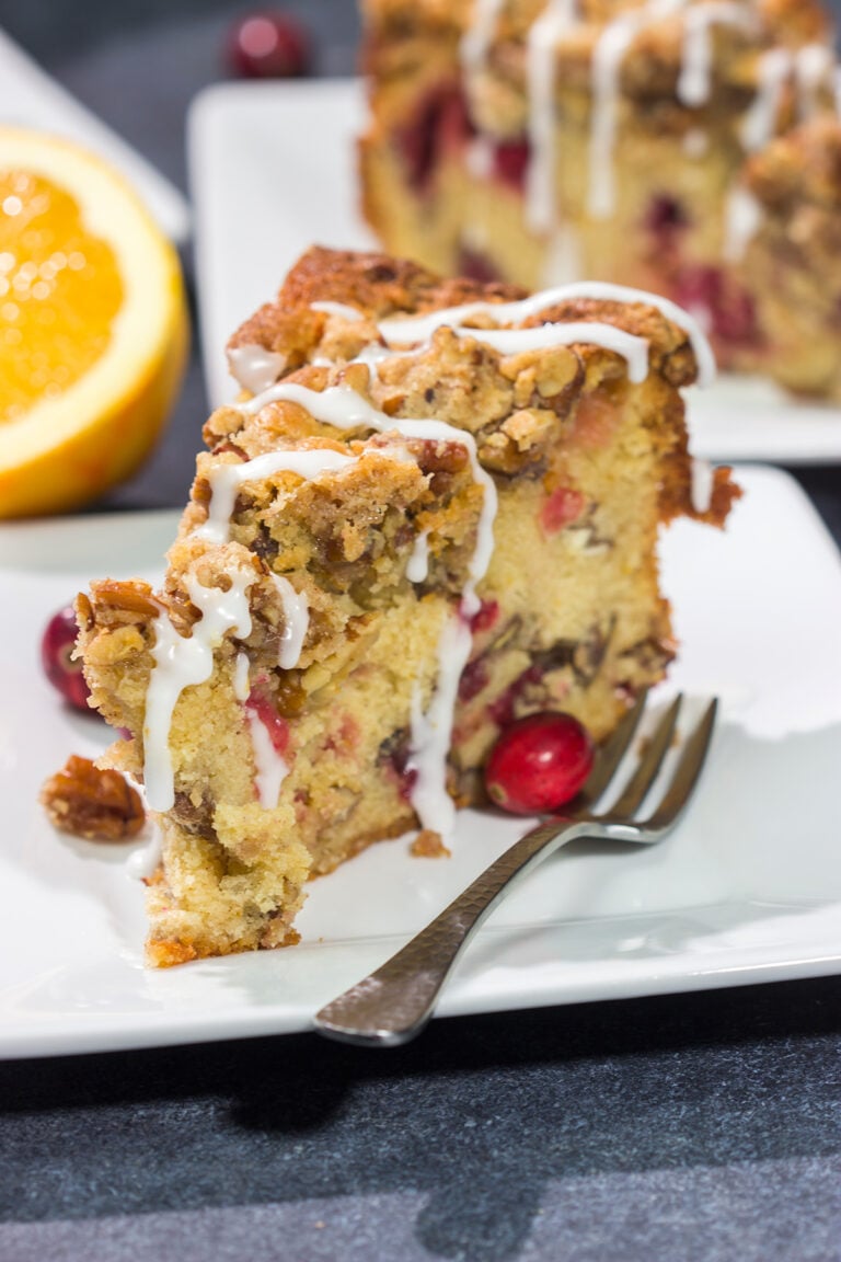 This Cranberry Pecan Coffee Cake is packed with pecans and fresh cranberries, and it's topped with a brown sugar streusel. This treat is perfect for holiday brunch!