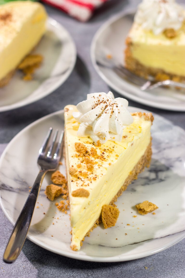 Who says ice cream is only for warm weather? This Eggnog Ice Cream Pie features creamy ice cream in a gingersnap cookie crust - it's a delicious treat for the holiday season!