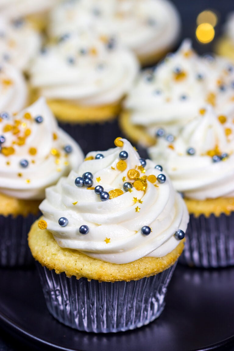 These Champagne Cupcakes feature tender vanilla cupcakes topped with creamy champagne buttercream. They're the perfect treat for New Year's Eve...or any other night of the year!
