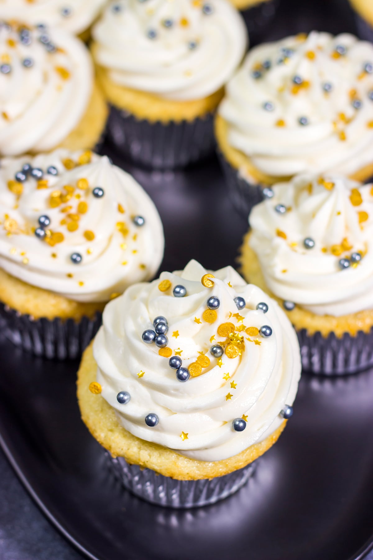 These Champagne Cupcakes feature tender vanilla cupcakes topped with creamy champagne buttercream. They're the perfect treat for New Year's Eve...or any other night of the year!