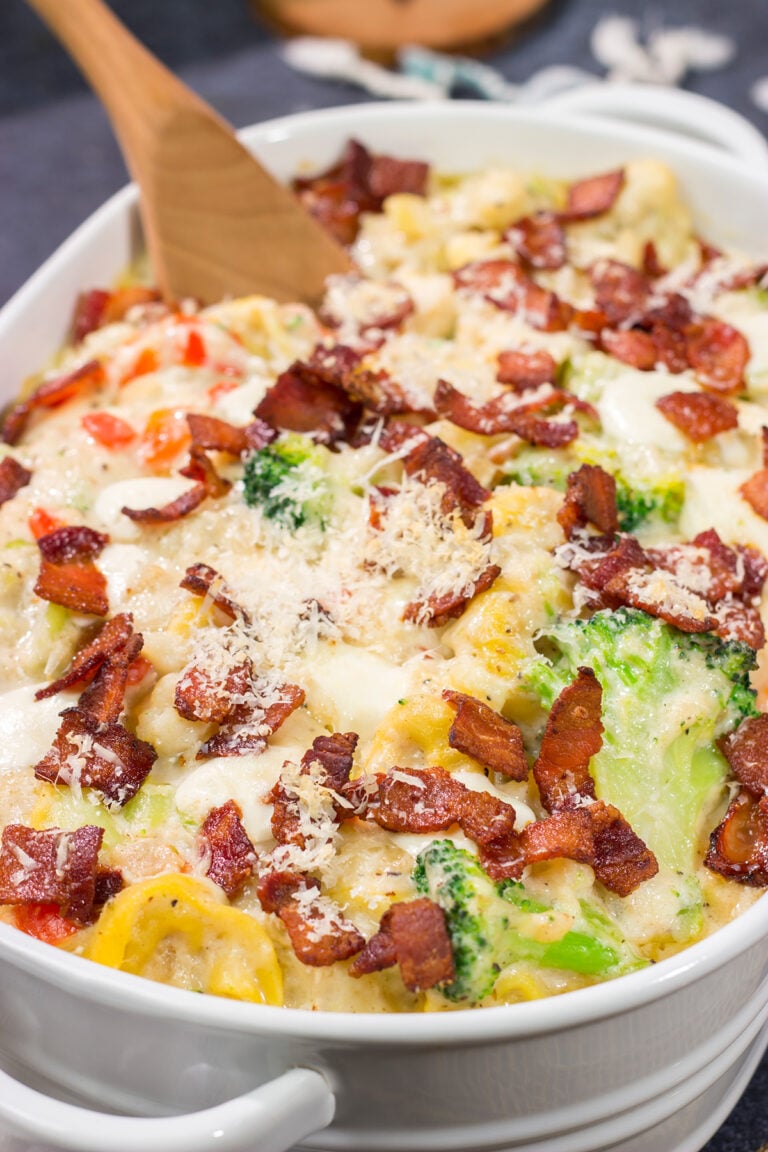 Featuring tender tortellini pasta mixed with a creamy sauce, this Cheesy Tortellini Casserole is the ultimate comfort food recipe!