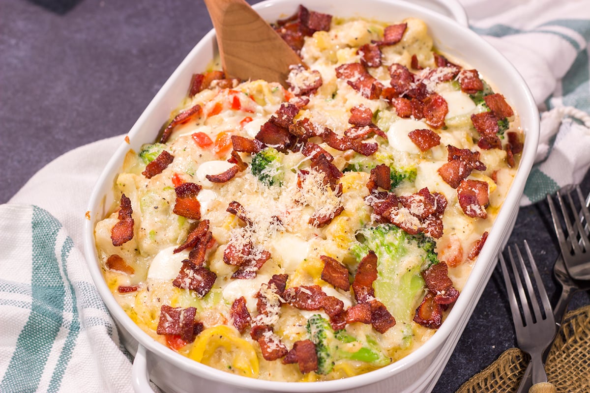 Featuring tender tortellini pasta mixed with a creamy sauce, this Cheesy Tortellini Casserole is the ultimate comfort food recipe!