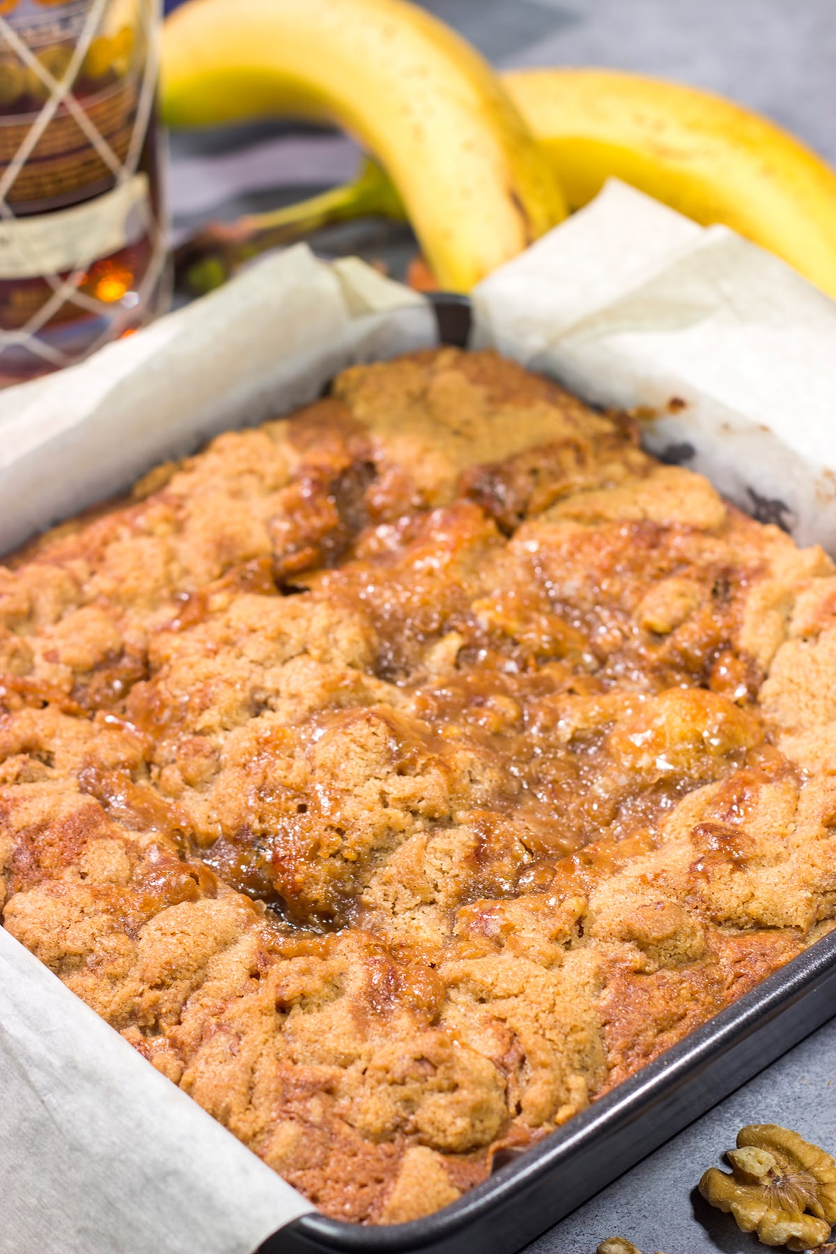 Featuring the flavors of the classic New Orleans dessert, this Bananas Foster Cake is truly fantastic! The tender cake is topped with a brown sugar streusel and rum sauce. Grab a fork!