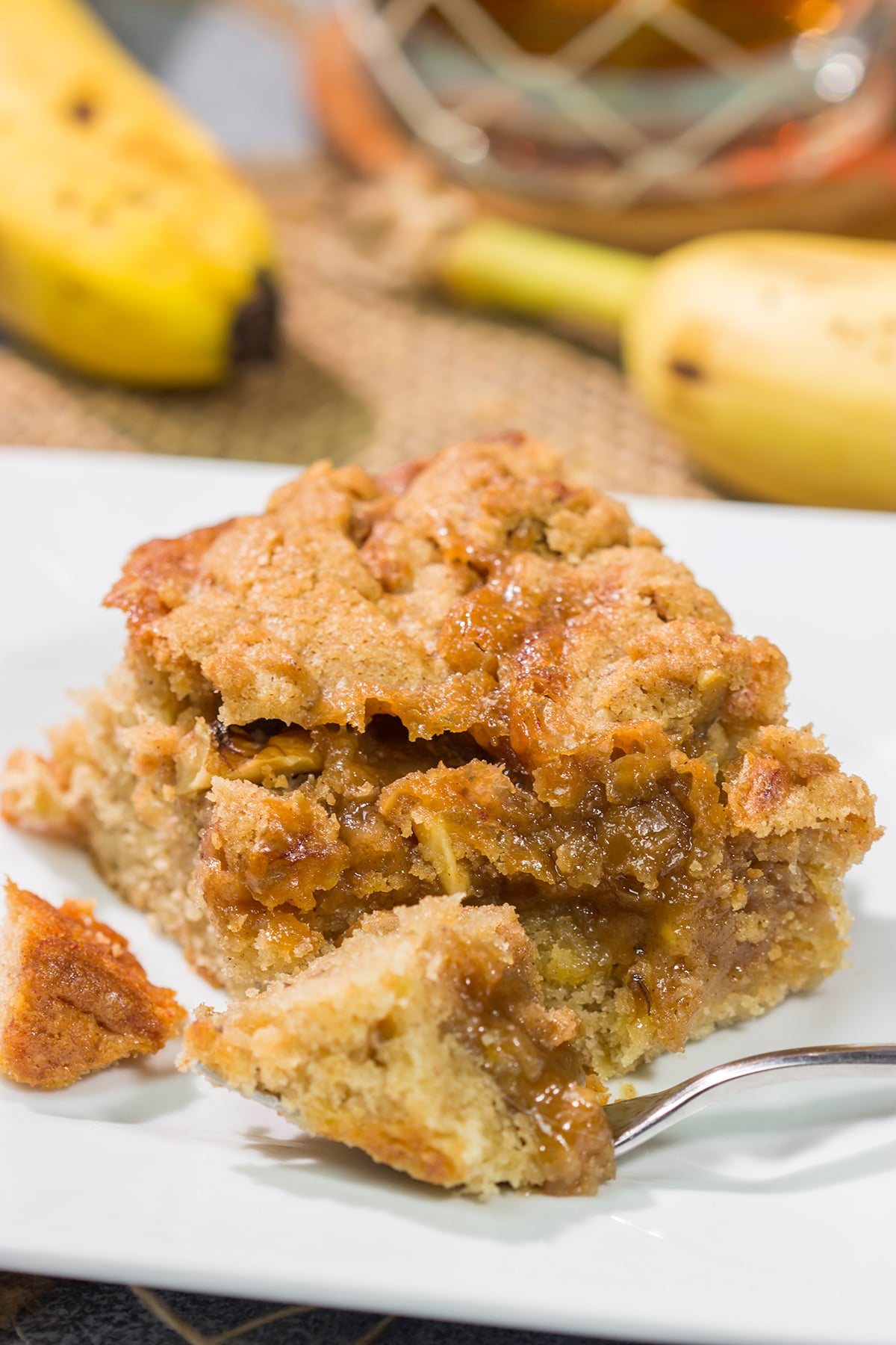 Featuring the flavors of the classic New Orleans dessert, this Bananas Foster Cake is truly fantastic! The tender cake is topped with a brown sugar streusel and rum sauce. Grab a fork!