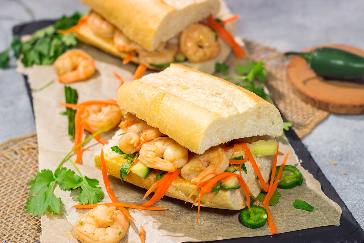 Shrimp Banh Mi is a classic Vietnamese street food...and it's surprisingly easy to make at home. Seasoned shrimp, tangy vegetables and fresh herbs combine to create a delicious sandwich!