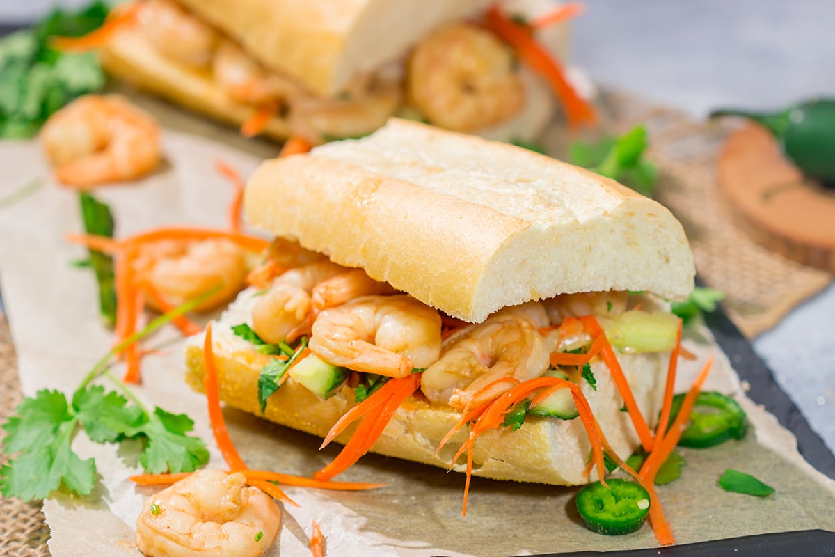 Shrimp Banh Mi is a classic Vietnamese street food...and it's surprisingly easy to make at home. Seasoned shrimp, tangy vegetables and fresh herbs combine to create a delicious sandwich!