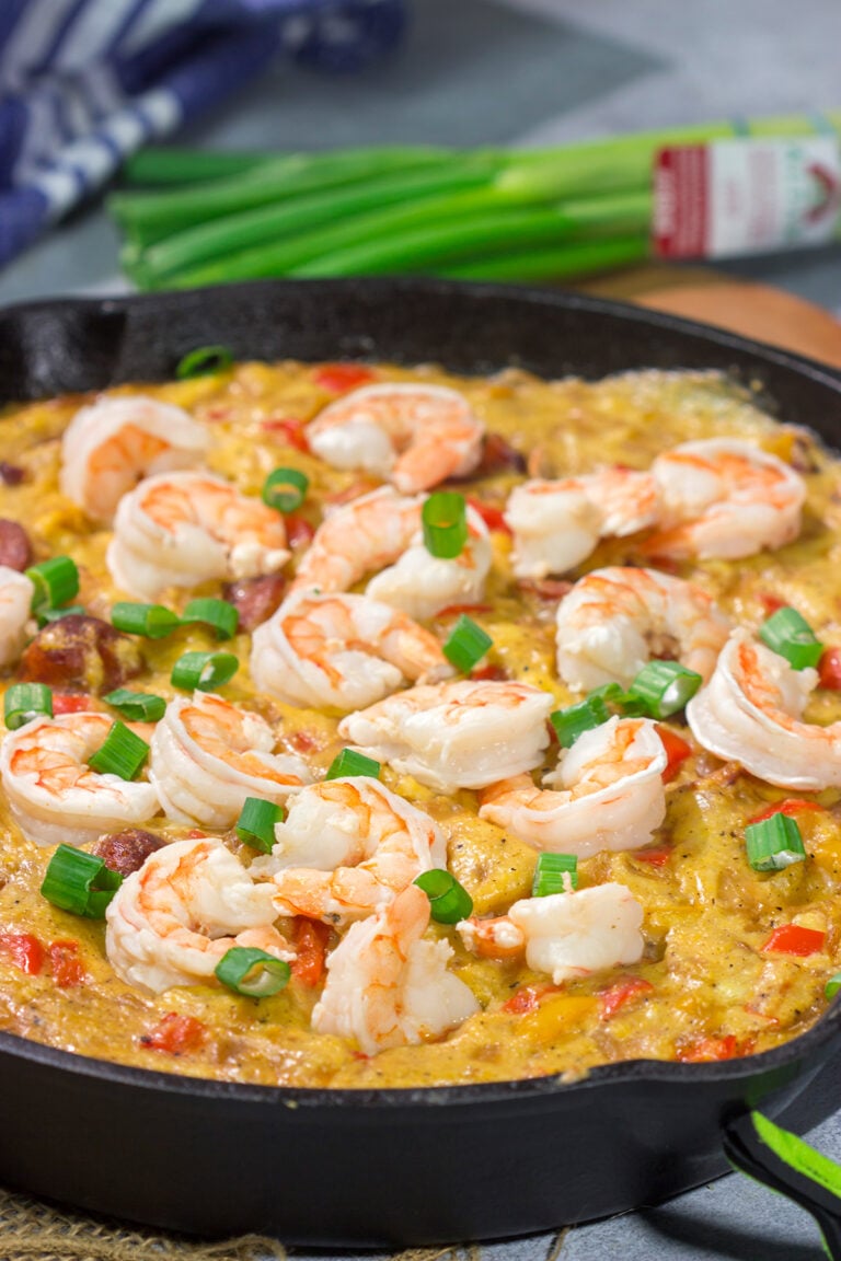 This Shrimp and Grits Casserole recipe is a fun twist on a classic. This flavor-packed casserole is the ultimate Southern comfort food!