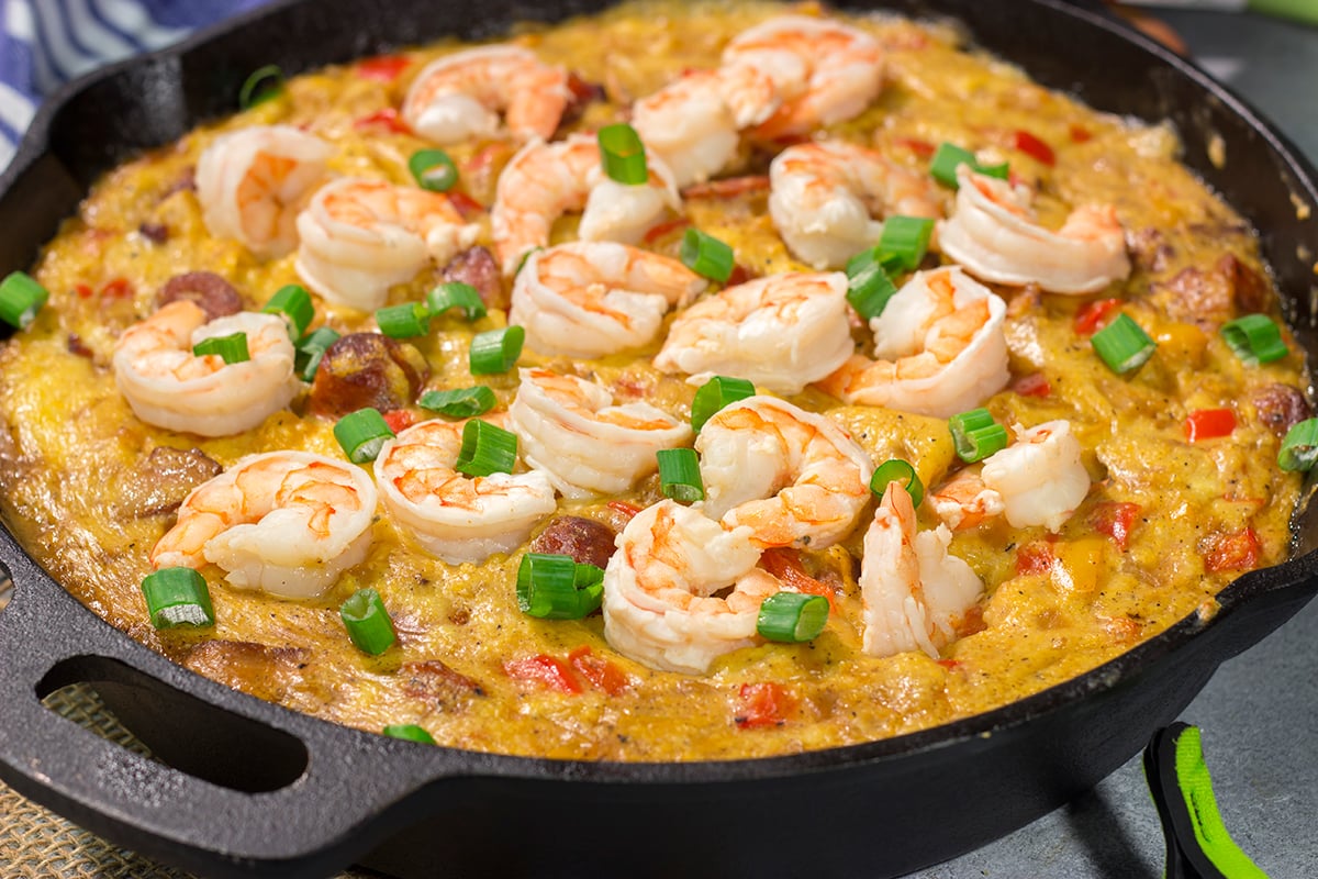 This Shrimp and Grits Casserole recipe is a fun twist on a classic. This flavor-packed casserole is the ultimate Southern comfort food!