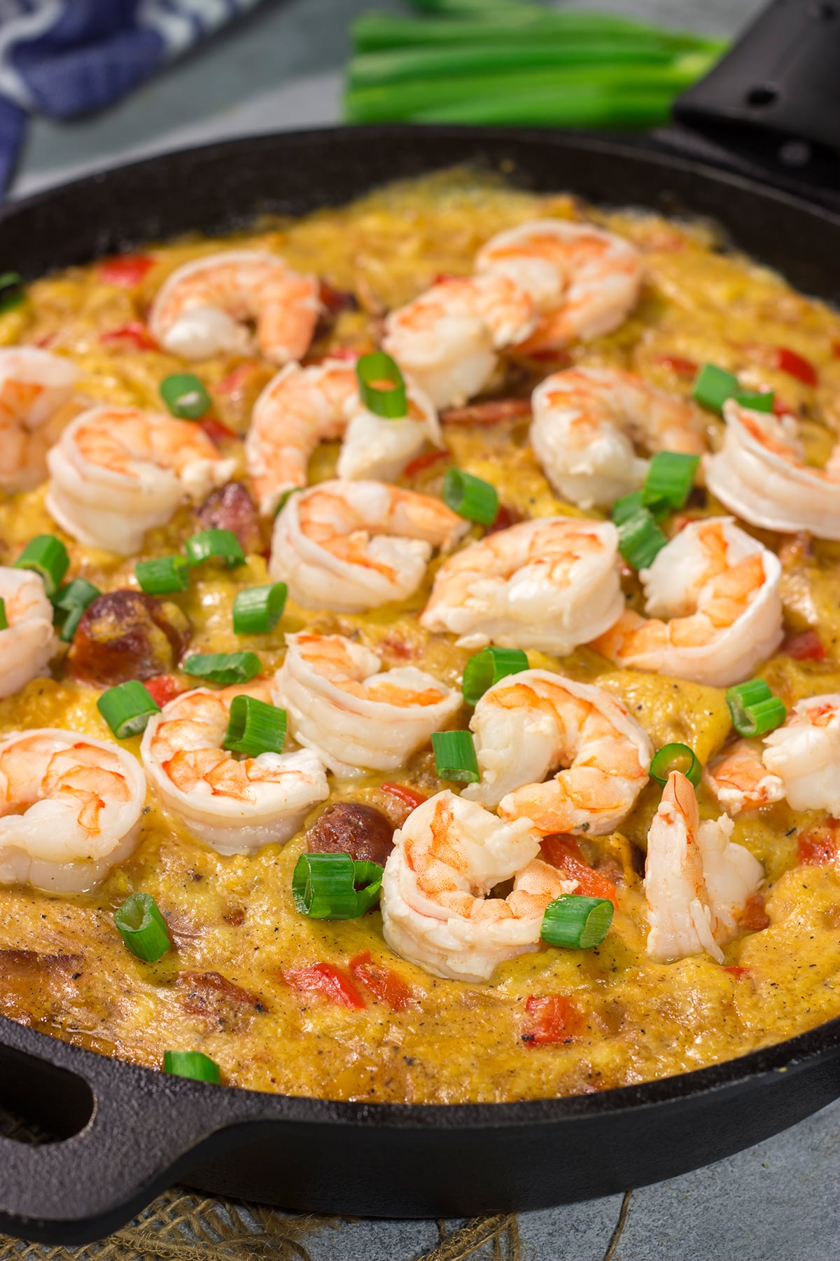 This Shrimp and Grits Casserole recipe is a fun twist on a classic. This flavor-packed casserole is the ultimate Southern comfort food!