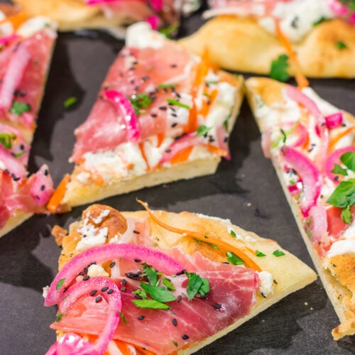 Featuring slightly crispy flatbread topped with creamy ricotta, this Whipped Ricotta Flatbread makes for an excellent summer lunch or appetizer. Cheers!