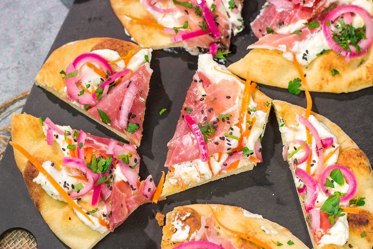 Featuring slightly crispy flatbread topped with creamy ricotta, this Whipped Ricotta Flatbread makes for an excellent summer lunch or appetizer. Cheers!