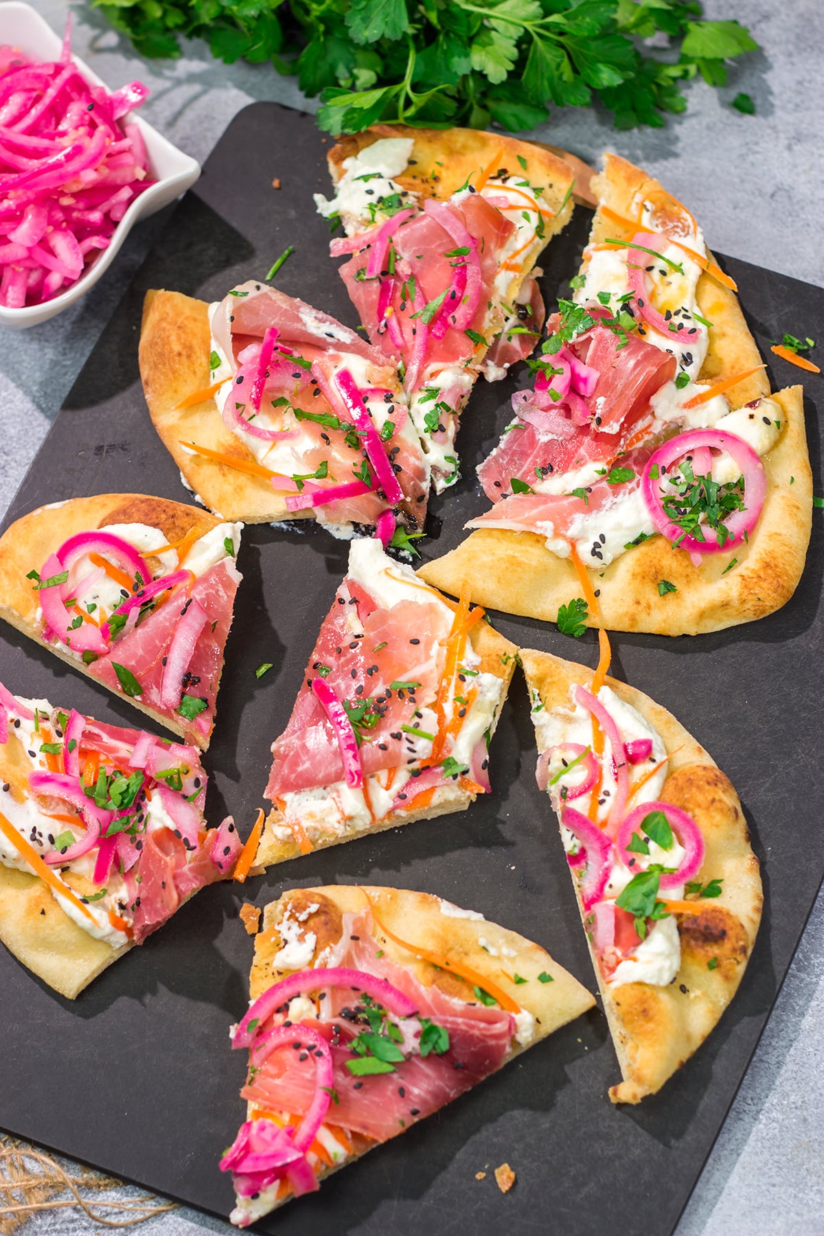 Featuring slightly crispy flatbread topped with creamy ricotta, this Whipped Ricotta Flatbread makes for an excellent summer lunch or appetizer. Cheers!