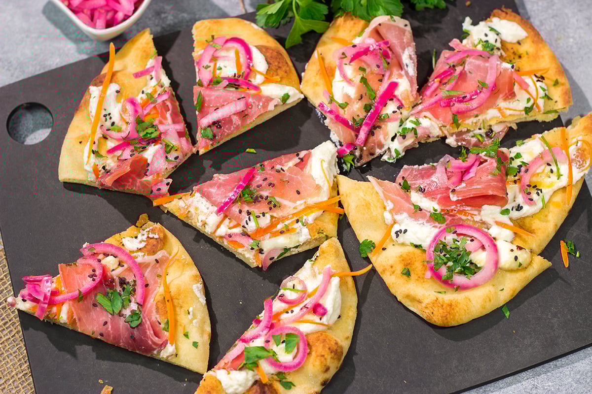 Featuring slightly crispy flatbread topped with creamy ricotta, this Whipped Ricotta Flatbread makes for an excellent summer lunch or appetizer. Cheers!