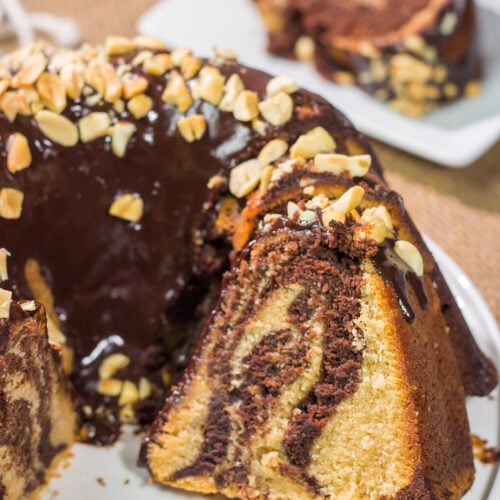 Featuring swirls of chocolate and peanut butter cake, this Chocolate Peanut Butter Pound Cake makes for a fun (and delicious) dessert recipe!