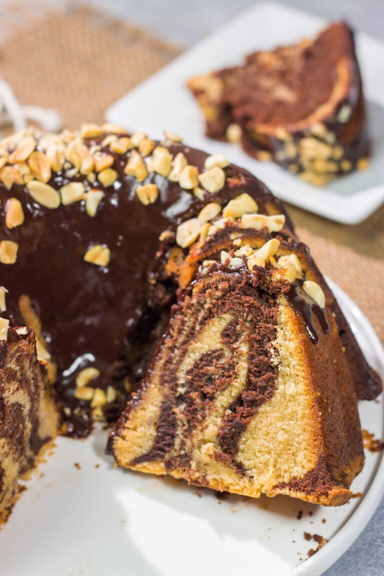 Featuring swirls of chocolate and peanut butter cake, this Chocolate Peanut Butter Pound Cake makes for a fun (and delicious) dessert recipe!