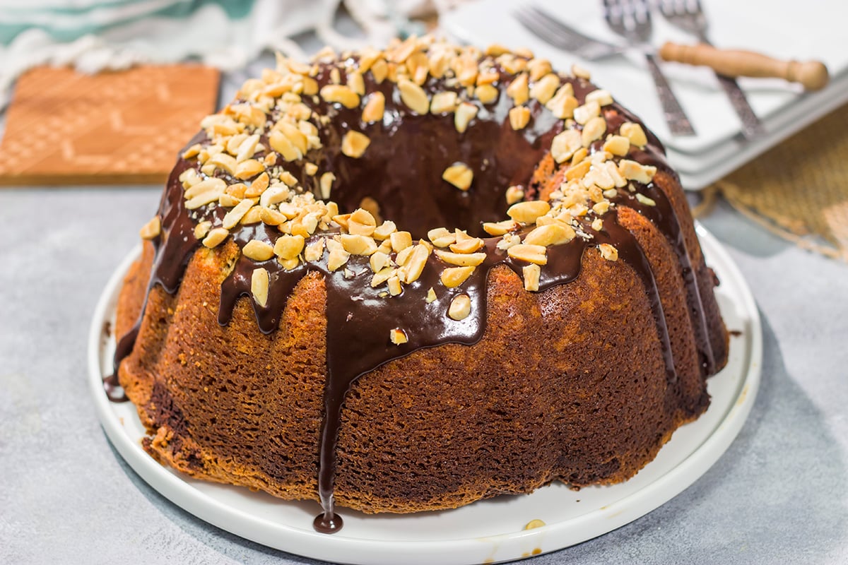 Featuring swirls of chocolate and peanut butter cake, this Chocolate Peanut Butter Pound Cake makes for a fun (and delicious) dessert recipe!