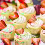 Featuring a splash of tequila and a swirl of fresh strawberry puree, these Mini Strawberry Margarita Cheesecakes are the perfect dessert for summer celebrations!