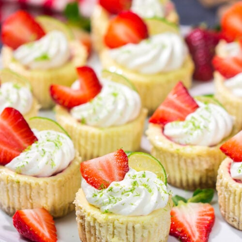 Featuring a splash of tequila and a swirl of fresh strawberry puree, these Mini Strawberry Margarita Cheesecakes are the perfect dessert for summer celebrations!