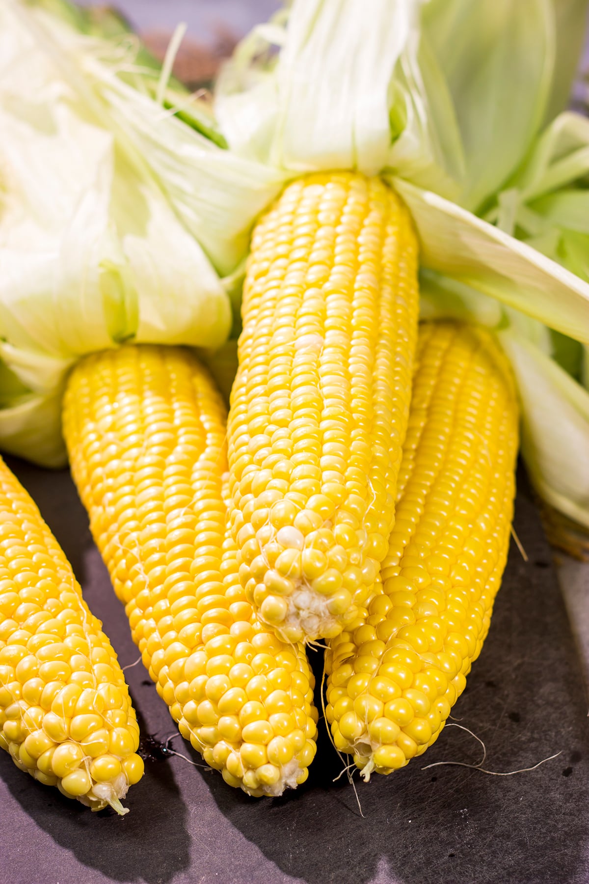 This Grilled Cajun Corn features Cajun butter rubbed on grilled corn. This makes for an excellent side dish next to juicy hamburgers or grilled hot dogs!