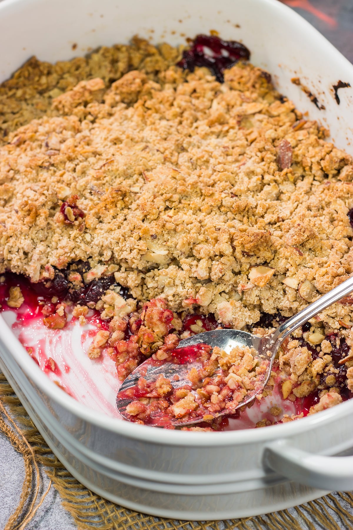 This Homemade Cherry Crisp is a simple dessert that the whole family will love. The homemade cherry filling gets topped with a crispy oat streusel...and a dollop of bourbon whipped cream!