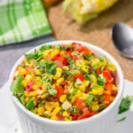 Featuring sweet corn and bell peppers combined with spicy jalapenos and tossed in lime butter, this Mexicali Corn recipe is a tasty side dish for summer meals!
