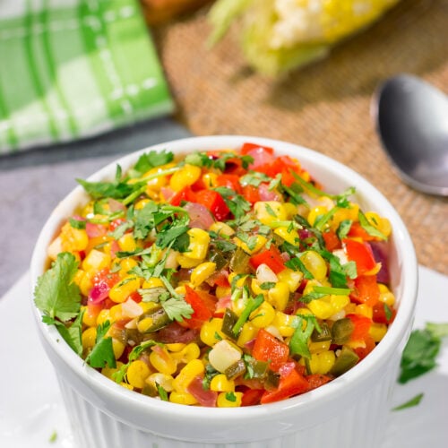 Featuring sweet corn and bell peppers combined with spicy jalapenos and tossed in lime butter, this Mexicali Corn recipe is a tasty side dish for summer meals!