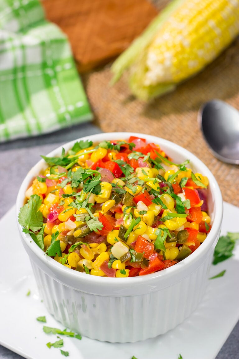 Featuring sweet corn and bell peppers combined with spicy jalapenos and tossed in lime butter, this Mexicali Corn recipe is a tasty side dish for summer meals!