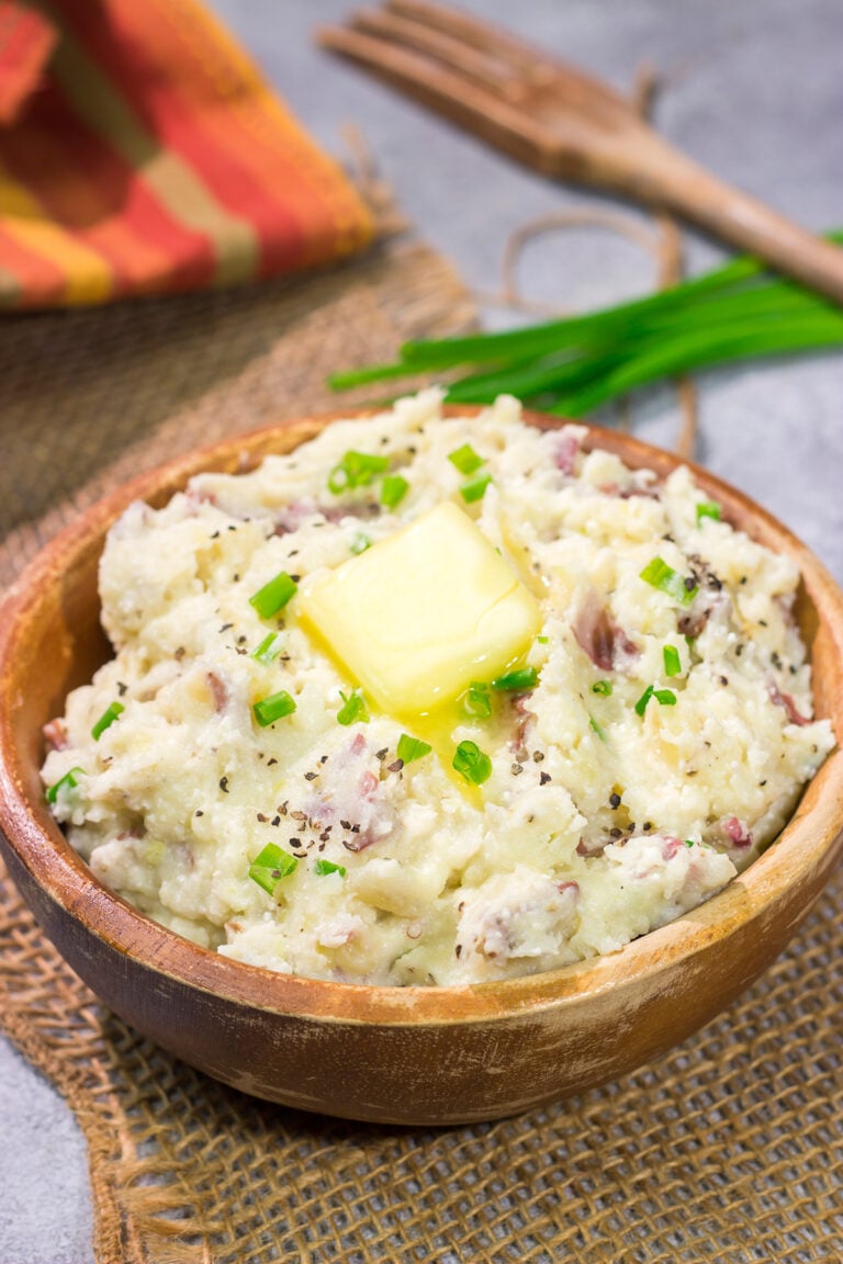 These Ricotta Mashed Potatoes are extra creamy and super flavorful. This easy side dish recipe is perfect for any occasion from weeknight meals to Thanksgiving dinners!
