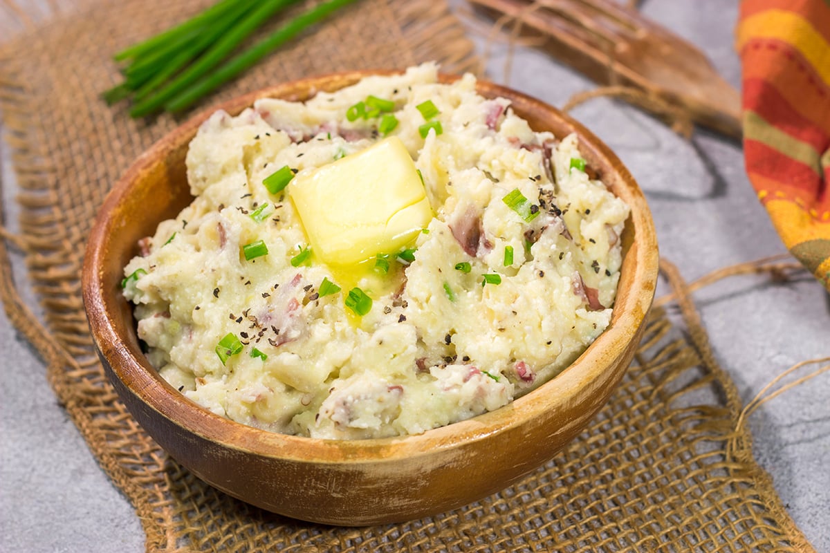 These Ricotta Mashed Potatoes are extra creamy and super flavorful. This easy side dish recipe is perfect for any occasion from weeknight meals to Thanksgiving dinners!