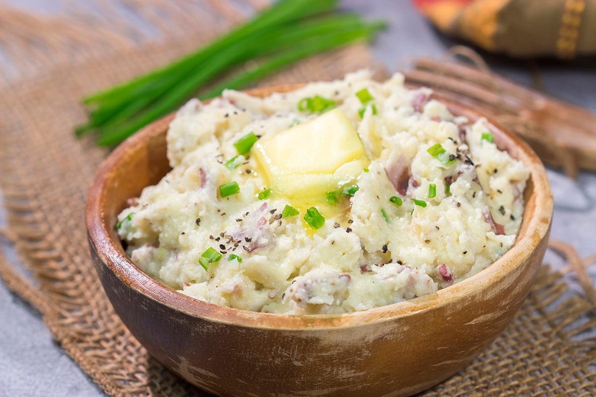 These Ricotta Mashed Potatoes are extra creamy and super flavorful. This easy side dish recipe is perfect for any occasion from weeknight meals to Thanksgiving dinners!