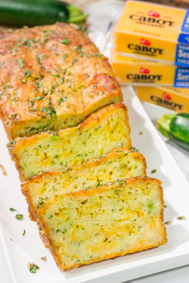 This Cheesy Zucchini Bread is packed with summer flavor! Toast up a slice of this savory quick bread and serve it next to salad or soup for an easy meal.