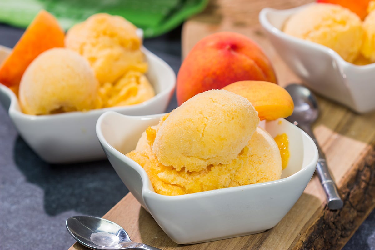 This Peach Sorbet uses only a few basic ingredients, and the result is an easy dairy-free dessert that tastes great on a hot summer day!