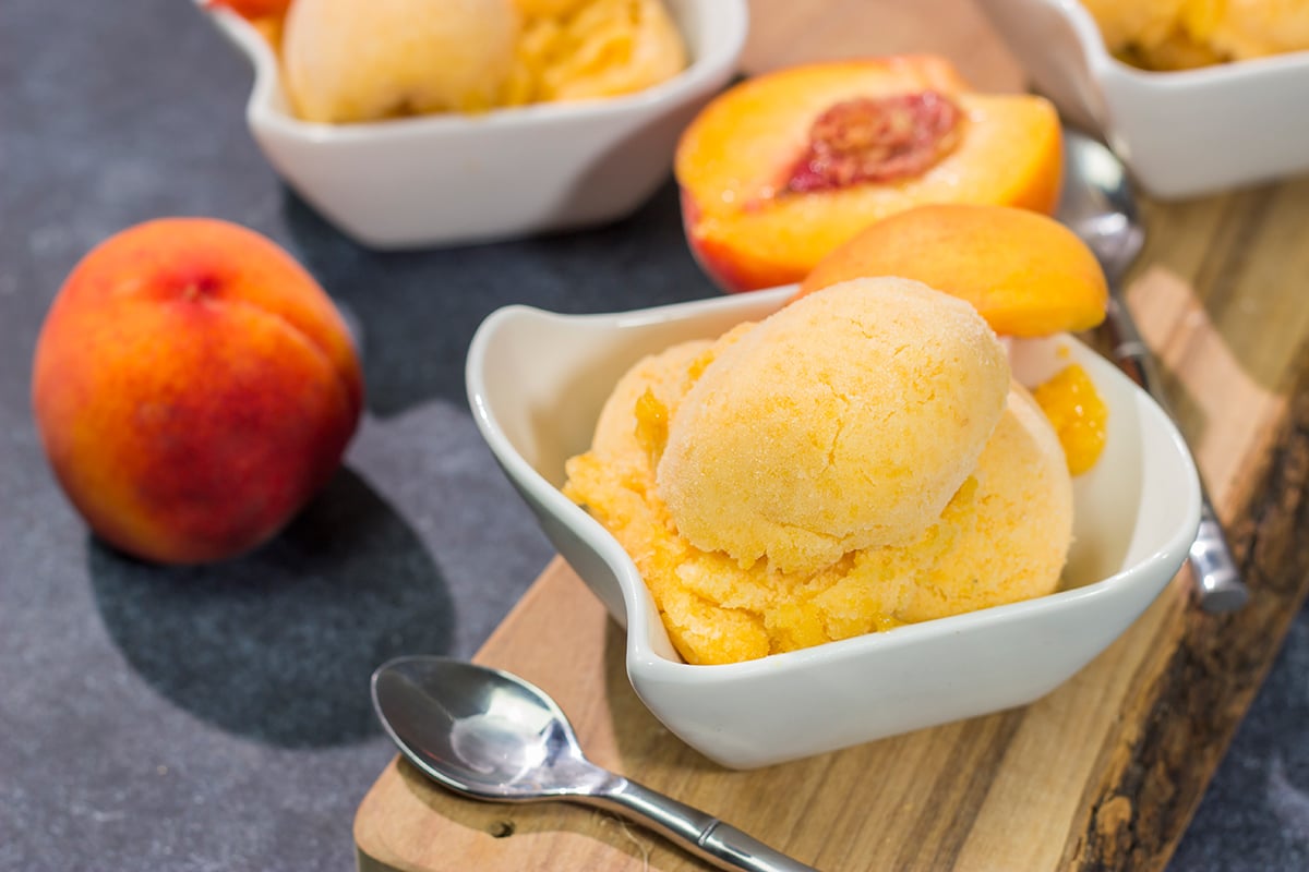 This Peach Sorbet uses only a few basic ingredients, and the result is an easy dairy-free dessert that tastes great on a hot summer day!