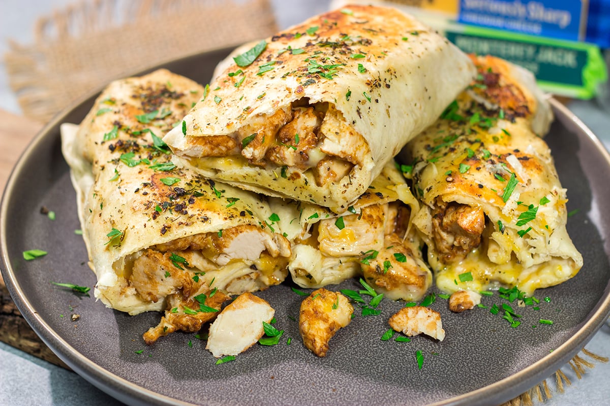 These Cheesy Chicken Wraps are a cinch to make...and they're sure to become a new family favorite. This recipe is perfect for busy weeknights!