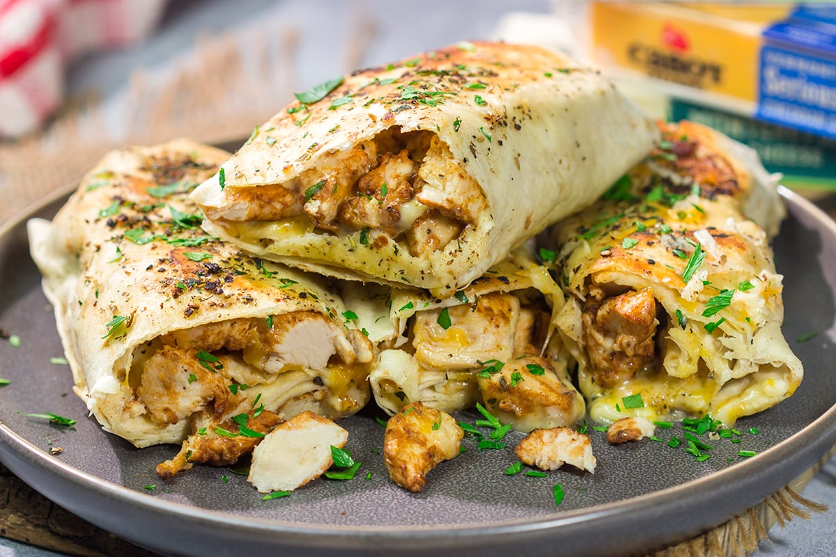 These Cheesy Chicken Wraps are a cinch to make...and they're sure to become a new family favorite. This recipe is perfect for busy weeknights!
