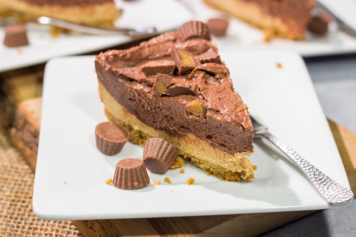 This Chocolate Peanut Butter Pie features a creamy peanut butter mousse topped with chocolate pudding...all over a thick graham cracker crust. It's an easy and delicious dessert recipe!