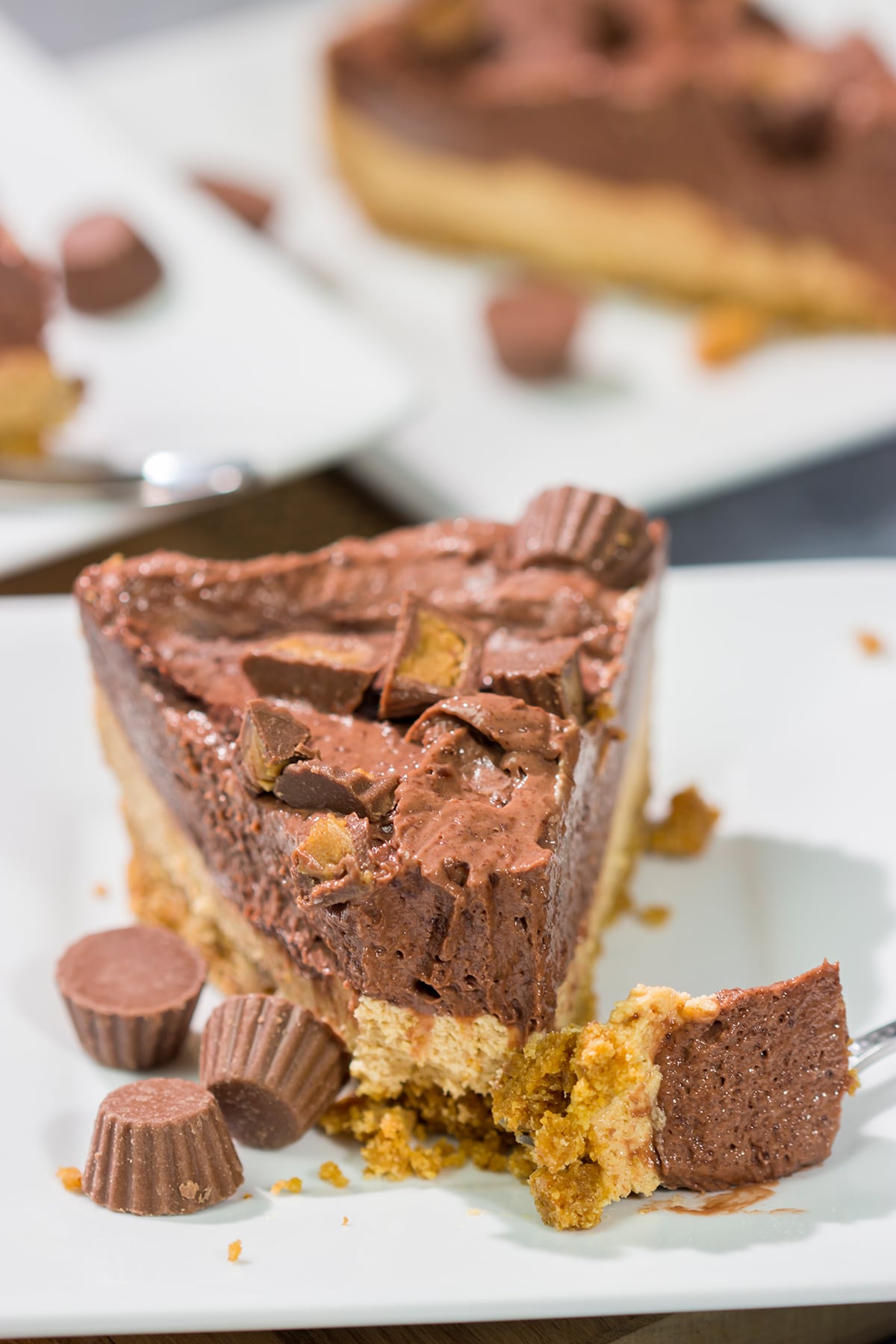 This Chocolate Peanut Butter Pie features a creamy peanut butter mousse topped with chocolate pudding...all over a thick graham cracker crust. It's an easy and delicious dessert recipe!