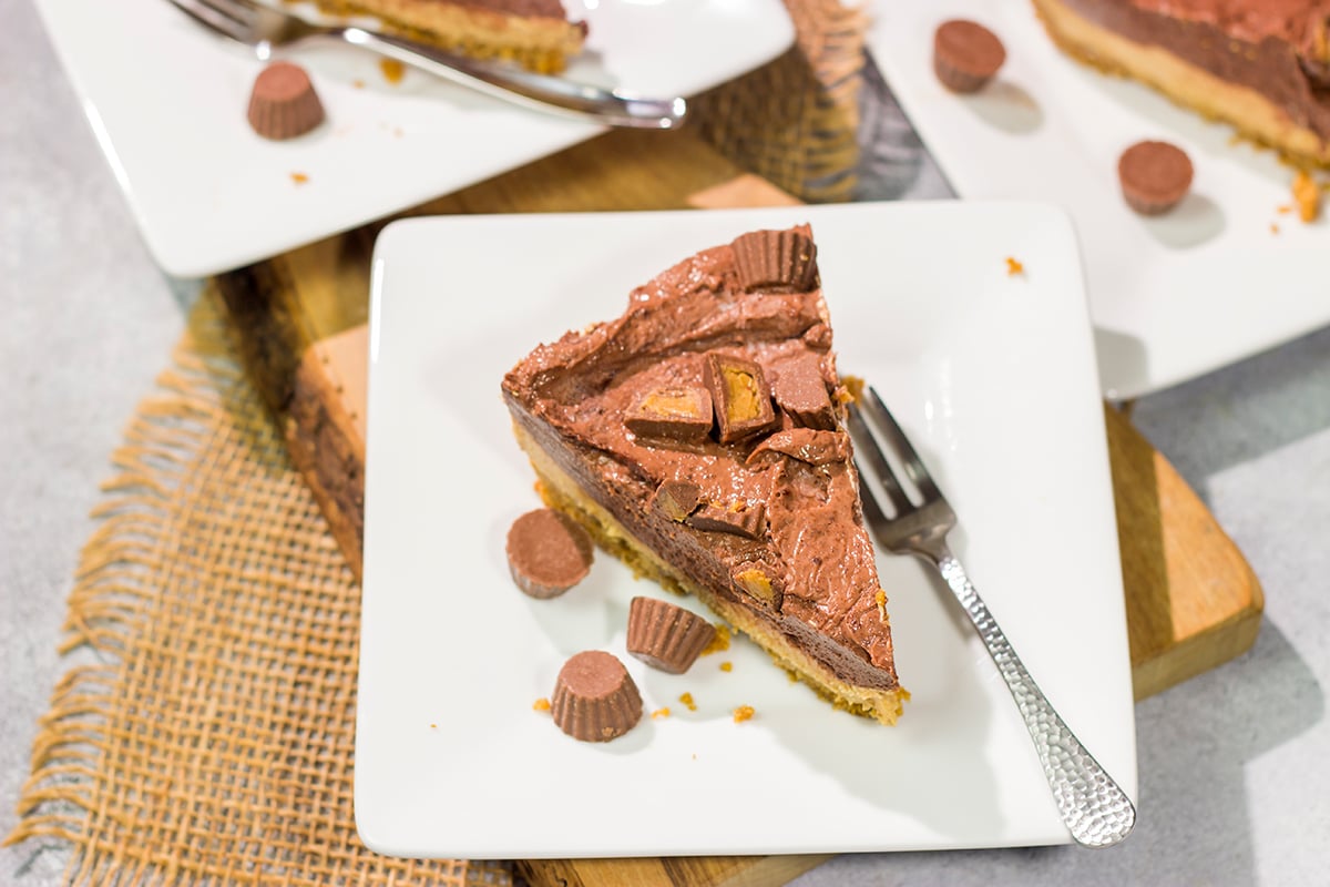 This Chocolate Peanut Butter Pie features a creamy peanut butter mousse topped with chocolate pudding...all over a thick graham cracker crust. It's an easy and delicious dessert recipe!
