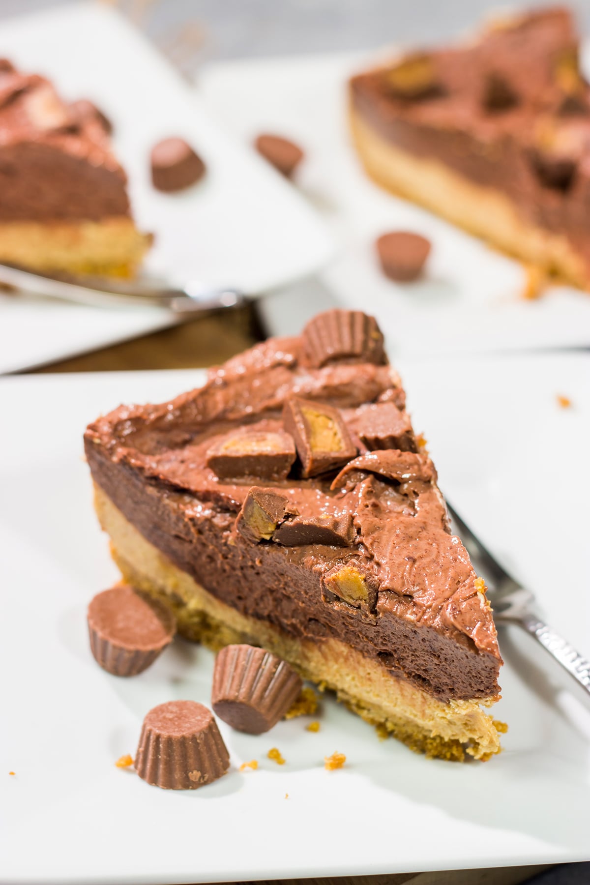 This Chocolate Peanut Butter Pie features a creamy peanut butter mousse topped with chocolate pudding...all over a thick graham cracker crust. It's an easy and delicious dessert recipe!