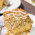 This Maple Pecan Coffee Cake features the cozy flavors of maple, cinnamon and brown sugar. A warm slice of this cake next to a cup of coffee is the perfect way to start a fall day!